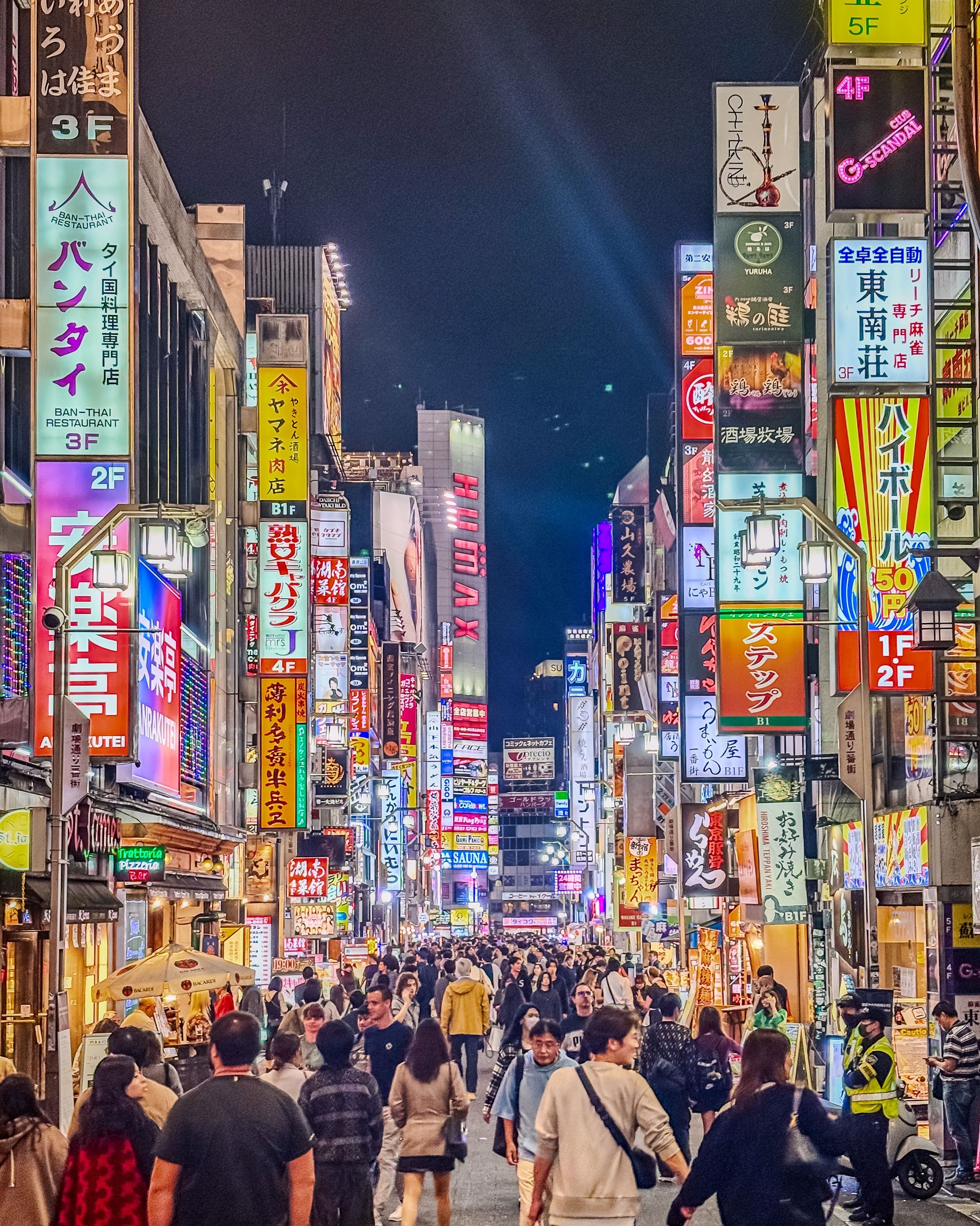 Vibrant Nightlife on a Bustling City Street in Tokyo